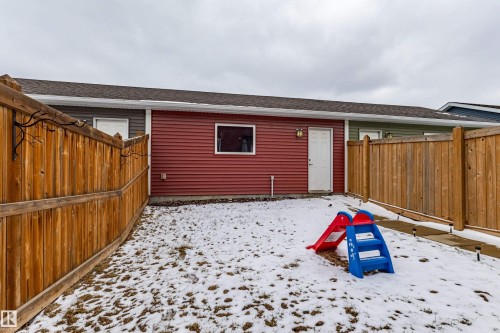 The property features a fenced yard, a rear entrance, and exterior siding - 2679 Maple Way, Edmonton, AB - Outdoor With Exterior