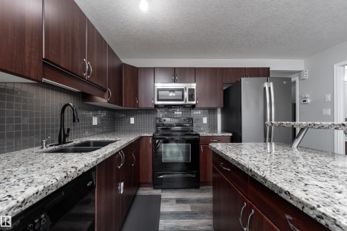 5911 8 Avenue, Edmonton, AB - Indoor Photo Showing Kitchen With Stainless Steel Kitchen With Double Sink With Upgraded Kitchen