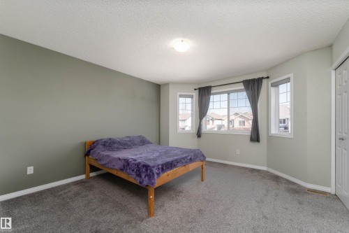 Features his & hers closets, comfortably fits a king size bed - 5911 8 Avenue, Edmonton, AB - Indoor Photo Showing Bedroom