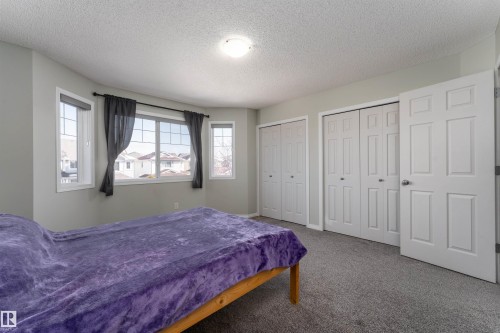 Features his & hers closets, comfortably fits a king size bed - 5911 8 Avenue, Edmonton, AB - Indoor Photo Showing Bedroom