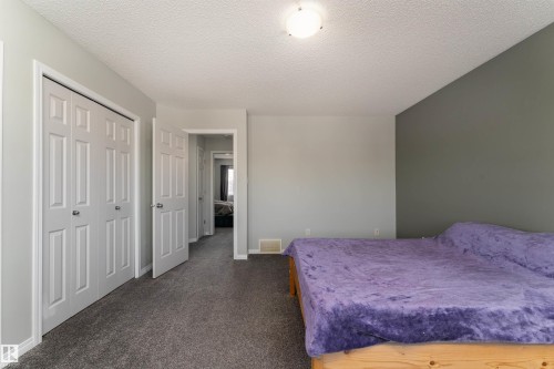 Features his & hers closets, comfortably fits a king size bed - 5911 8 Avenue, Edmonton, AB - Indoor Photo Showing Bedroom
