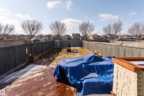 South facing backyard with two tier deck and fire pit - 5911 8 Avenue, Edmonton, AB - Outdoor With Deck Patio Veranda