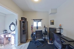 Versatile room featuring light-toned walls, a window with natural light, and light-colored flooring - 