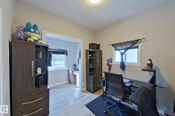 This room features light-colored walls and flooring, with a window providing natural light - 