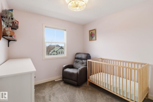 This room features light-colored walls and grey carpet flooring - 430 Watt Boulevard, Edmonton, AB - Indoor Photo Showing Bedroom