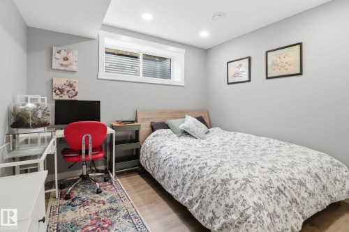 This room features light gray walls, recessed lighting, and a window with white trim - 430 Watt Boulevard, Edmonton, AB - Indoor Photo Showing Bedroom