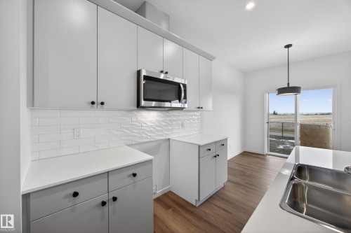 284 Lodge Pole Place, Leduc, AB - Indoor Photo Showing Kitchen With Double Sink