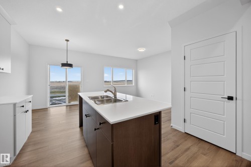 284 Lodge Pole Place, Leduc, AB - Indoor Photo Showing Kitchen With Double Sink