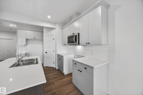 284 Lodge Pole Place, Leduc, AB - Indoor Photo Showing Kitchen With Double Sink