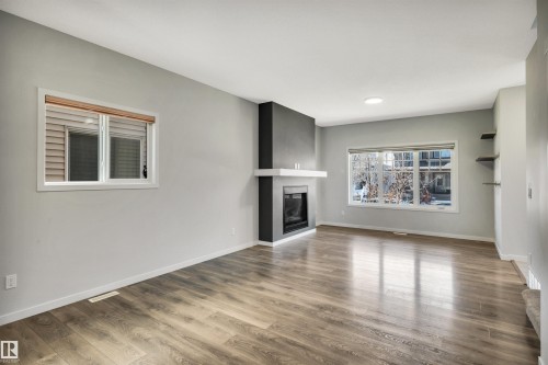 4022 Allan Crescent Sw, Edmonton, AB - Indoor Photo Showing Living Room With Fireplace