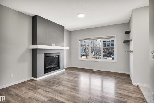 4022 Allan Crescent Sw, Edmonton, AB - Indoor Photo Showing Living Room With Fireplace