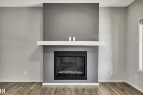 4022 Allan Crescent Sw, Edmonton, AB - Indoor Photo Showing Living Room With Fireplace