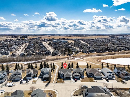 Aerial view of the property with a visible front yard and an attached garage - 5201 40 Avenue, Beaumont, AB - Outdoor With View