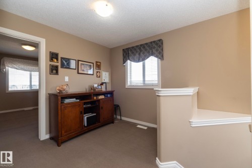 This area features light beige walls and a window with blinds, allowing for natural light - 130 Kirpatrick Way, Leduc, AB - Indoor