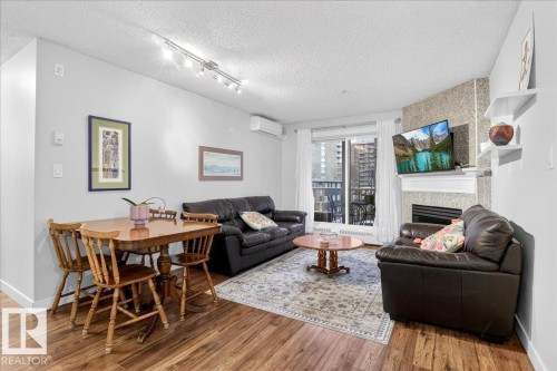 307 11716 100 Avenue, Edmonton, AB - Indoor Photo Showing Living Room With Fireplace