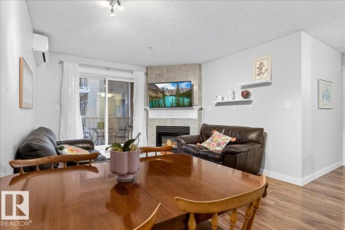 307 11716 100 Avenue, Edmonton, AB - Indoor Photo Showing Living Room With Fireplace