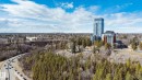 The property is situated within a vibrant community, surrounded by extensive natural landscapes including dense forests and a winding road - 206 10108 125 Street, Edmonton, AB  - Outdoor With View 