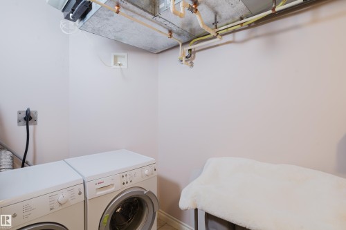 Dedicated laundry area featuring a washer and dryer - 206 10108 125 Street, Edmonton, AB - Indoor Photo Showing Laundry Room