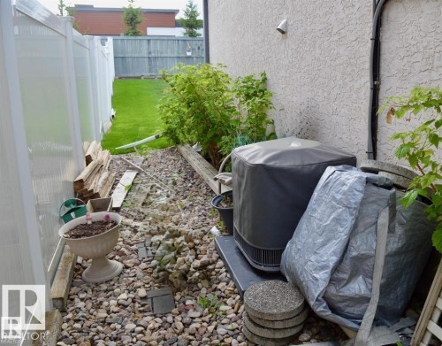 Outdoor area featuring a gravel path and a landscaped garden bed - 16832 79 Street Nw, Edmonton, AB -  With Exterior