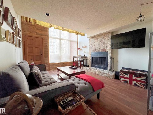 10346A 121 Street, Edmonton, AB - Indoor Photo Showing Living Room With Fireplace