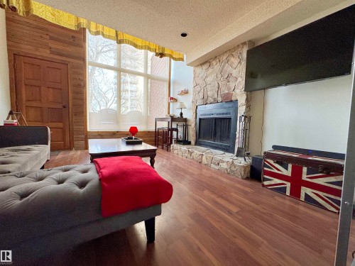 10346A 121 Street, Edmonton, AB - Indoor Photo Showing Living Room With Fireplace