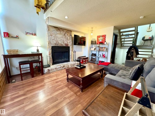 10346A 121 Street, Edmonton, AB - Indoor Photo Showing Living Room With Fireplace