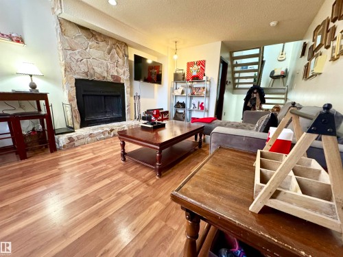 10346A 121 Street, Edmonton, AB - Indoor Photo Showing Living Room With Fireplace