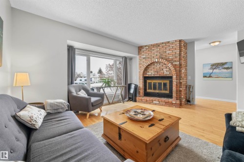 1127 36 Street, Edmonton, AB - Indoor Photo Showing Living Room With Fireplace