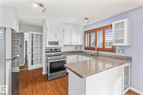 8715 43 Avenue, Edmonton, AB - Indoor Photo Showing Kitchen With Double Sink