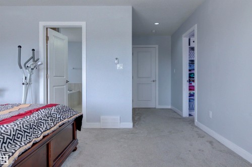 Room with light gray walls, gray carpet, and white trim - 8452 Cushing Crest, Edmonton, AB - Indoor Photo Showing Other Room