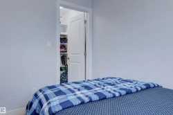 The property features a room with light-colored walls and a closet with shelving - 