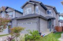 The property features a two-story exterior with light gray siding and dark grey stone accents - 8452 Cushing Crest, Edmonton, AB  - Outdoor 