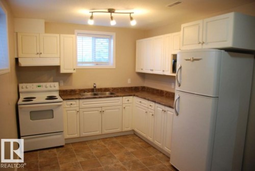 12720 135 Avenue, Edmonton, AB - Indoor Photo Showing Kitchen With Double Sink