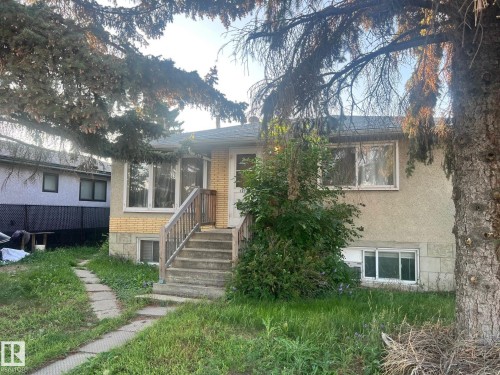 View of front facade featuring brick siding and stucco siding - 12720 135 Avenue, Edmonton, AB - Outdoor