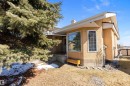 The property features an exterior with stucco siding and a prominent bay window - 14 920 119 Street, Edmonton, AB  - Outdoor 
