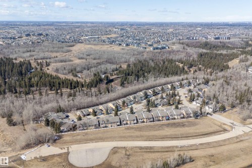 Aerial view of the community, showcasing surrounding wooded areas and residential properties - 14 920 119 Street, Edmonton, AB - Outdoor With View