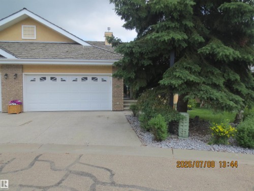 Attached two-car garage with decorative window inserts - 14 920 119 Street, Edmonton, AB 
