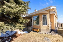The property features an exterior with stucco siding and a prominent bay window - 