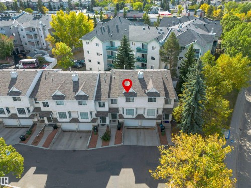The property is a multi-story townhome featuring a driveway and an attached garage - 2 9703 174 Street, Edmonton, AB - Outdoor