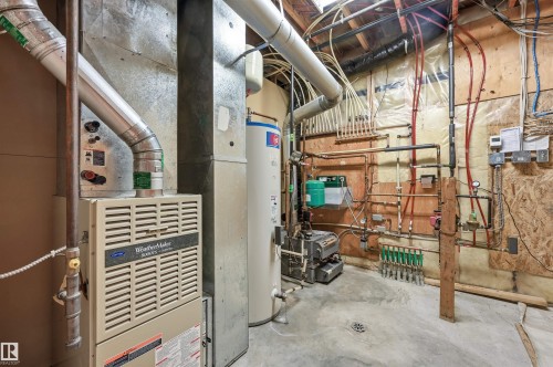 One of two mechanical rooms - 15625 Whitemud Road, Edmonton, AB - Indoor Photo Showing Basement