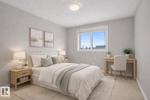 This room features neutral-toned walls, a window providing natural light, and a ceiling light fixture - 16419 53 Street, Edmonton, AB - Indoor Photo Showing Bedroom