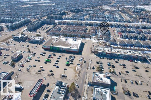 This aerial view showcases the property's location within a developed community, surrounded by residential areas and commercial establishments - 16419 53 Street, Edmonton, AB - Outdoor With View