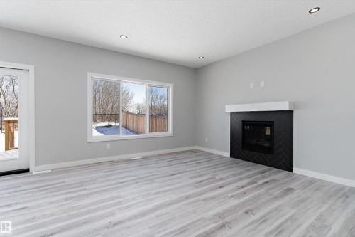 36 Maple Crescent, Gibbons, AB - Indoor Photo Showing Living Room With Fireplace