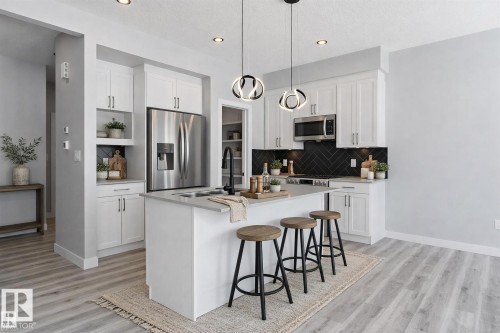 Virtually Staged - 36 Maple Crescent, Gibbons, AB - Indoor Photo Showing Kitchen With Upgraded Kitchen