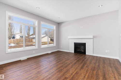 72 Maple Crescent, Gibbons, AB - Indoor Photo Showing Living Room With Fireplace