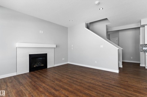 72 Maple Crescent, Gibbons, AB - Indoor Photo Showing Living Room With Fireplace