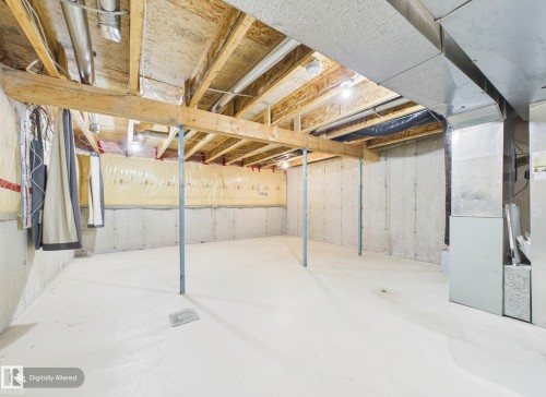 The property features an unfinished basement with exposed wooden beams, concrete walls, and a painted concrete floor - 9073 Scott Crescent, Edmonton, AB - Indoor Photo Showing Basement