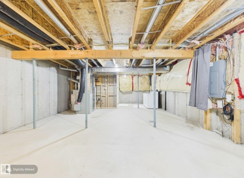 The property features a spacious unfinished basement with concrete walls and flooring, offering significant potential for customization - 9073 Scott Crescent, Edmonton, AB - Indoor Photo Showing Basement