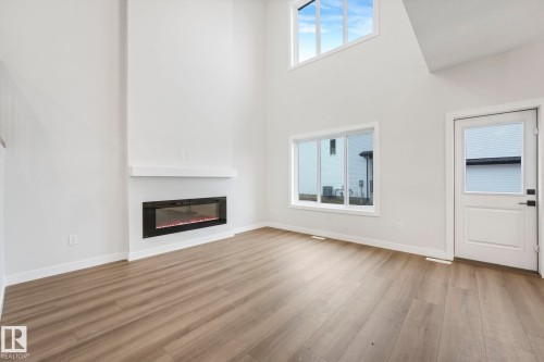 14 Dalquist Bay, Leduc, AB - Indoor Photo Showing Living Room With Fireplace