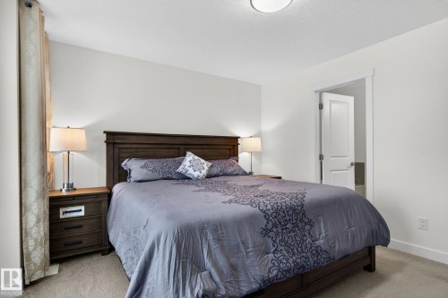 Bedroom with light-colored walls and carpet flooring - 7344 177 Avenue, Edmonton, AB - Indoor Photo Showing Bedroom